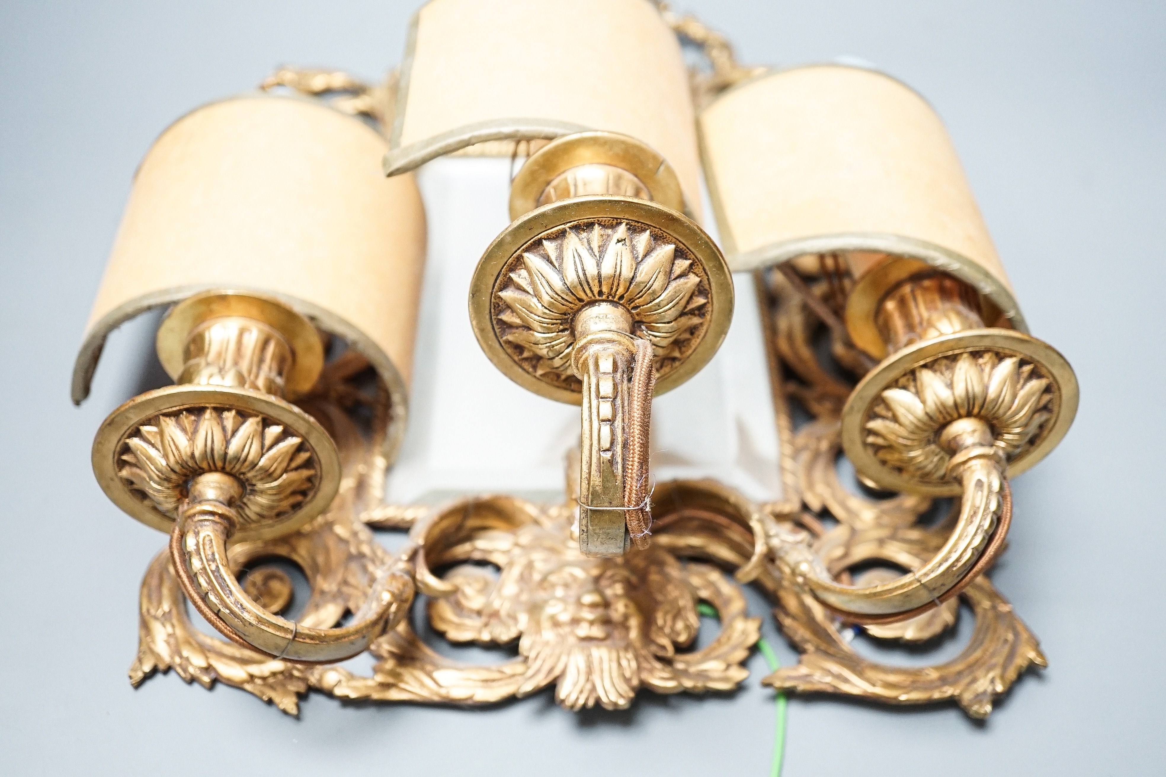 A pair of early 20th century gilt brass girandole mirrors, 39cms high.